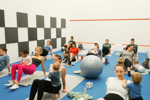 Fort Rucker moms and their babies attend Core and Cuddles, a new strength focused playgroup offered through the new parent support program at the physical fitness center during the first class of 2026 on Jan. 9.