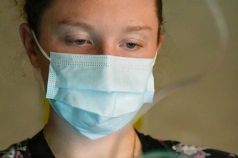 BAMC personnel assist patient during holiday event