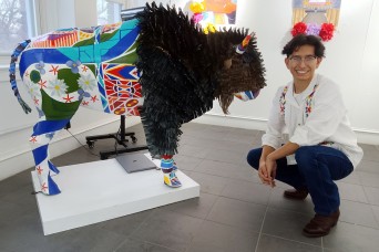 Emilio Gutierrez, Fort Leavenworth Lamp intern, gives talents to area "Spirit of the Buffalo" project. 