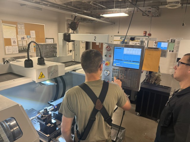 SSG Brandon Lee instructs PV2 Dillion Campbell how to set tool offset on the
CNC lathe at Fort Lee, Virginia, Oct. 8, 2025.