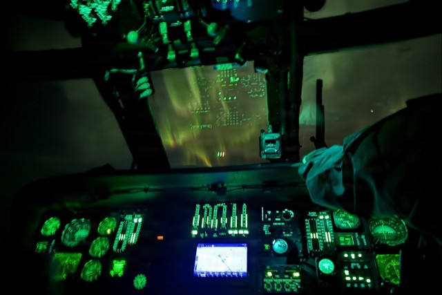 Alaska Army National Guardsmen conduct a nighttime medical evacuation mission