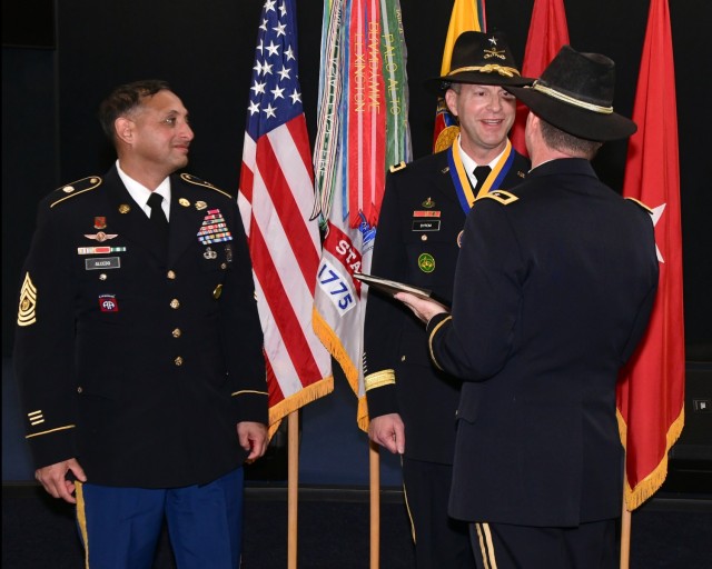 Brig. Gen. Jonathan C. Byrom is presented with a certificate of appreciation from the Commander in Chief by retired Maj. Gen. John Richardson during Byrom's retirement ceremony held Jan. 12 at the U.S. Army Aviation Museum. USACRC Command Sgt....