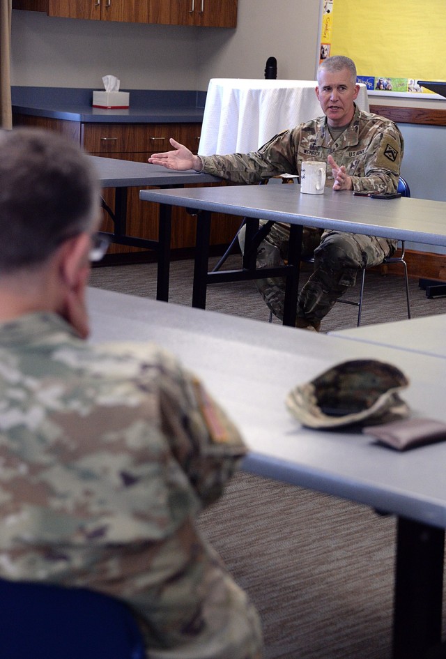 Operations Chaplain (Maj.) Christopher Weinrich talks with Family Life Chaplain (Maj.) Joshua Portwood and other Religious Support Office team members about the RSO’s positive Interactive Customer Evaluation (ICE) comment initiative during their...