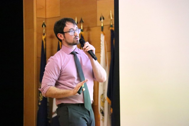 Alec Tsirigos of TDAC presents "Improved Artillery Effectiveness through Machine Learning" at APG Innovation Showcase in Myer Auditorium on January 20, 2026.