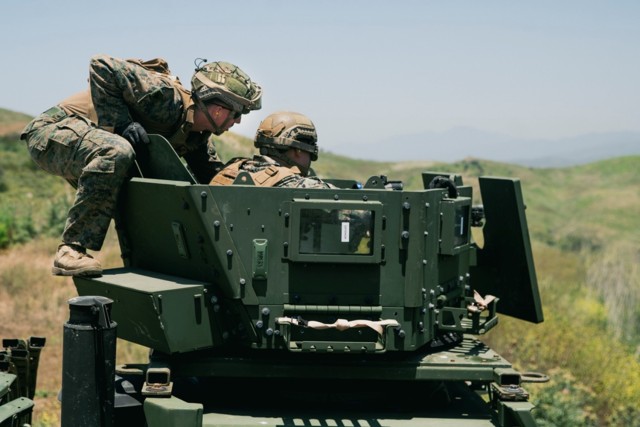 Marines assigned to Combat Logistics Battalion 15, 15th Marine Expeditionary Unit, train with the Reducible Height Gunner Protection Kit (RHGPK) during a crew-served weapons shoot at Marine Corps Base Camp Pendleton, California (U.S. Marine Corps...