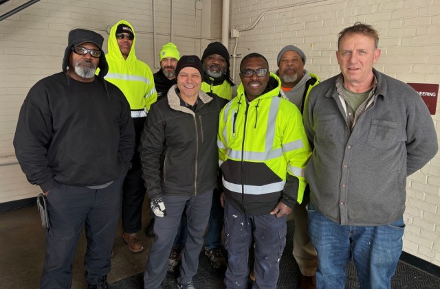 Col. Keith Sandoval, Joint Base Commander (second from the left), visits the Directorate of Public Works team, Jan. 28 to thank them for their hard work.  The team was responsible for plowing roads and responding to emergency work orders resulting...