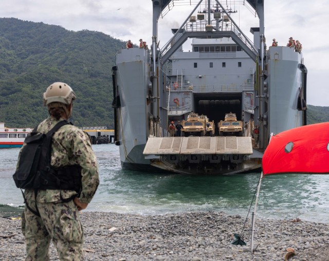 U.S. Navy Seaman Kaydia Martian, a flank petty officer assigned to Beach Master Unit 1, Navy Beach Group 1, watches USAV SSGT Robert T. Kuroda (LSV 7) to ensure proper landing during Salaknib 2025, at Dingalan Bay, Philippines, on April 6, 2025....