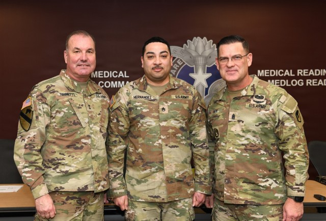 Coin presentation to Hernandez