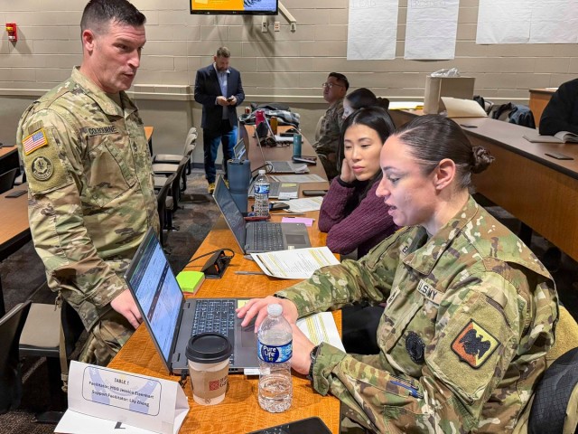 Sgt. 1st Class Heath Colbourne (left), Lafayette Recruiting Station commander, Master Sgt. Jessica Eisenhart, training development functional lead, and Ms. Lily Zhang, Deloitte AIE product lead, discuss future system enhancements during an AIE...