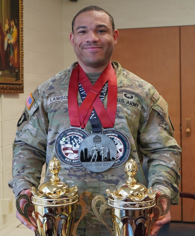 Army Sgt. Zephaniah Lawson poses with competition awards