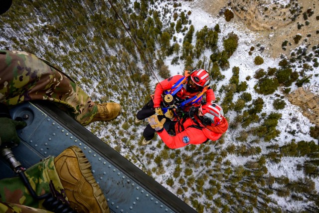 Wyoming Army Aviation teams and Big Horn County Serach and Rescue team perform hoist training
