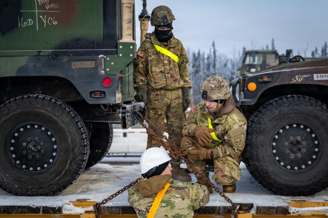 Soldiers load freight in preparation for JPMRC 26-02