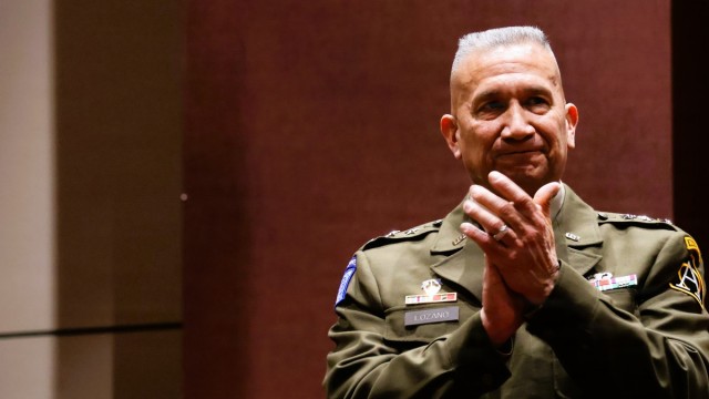 LTG Lozano applauds during ceremony