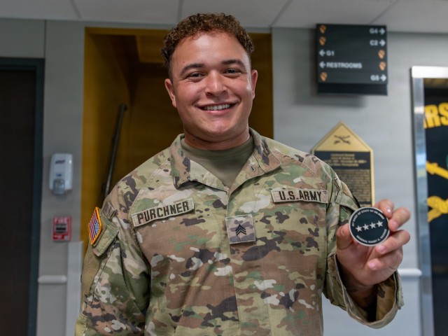 1st Cavalry Division Best Drone Warfighter competitors receive coins from Chief of Staff of the Army