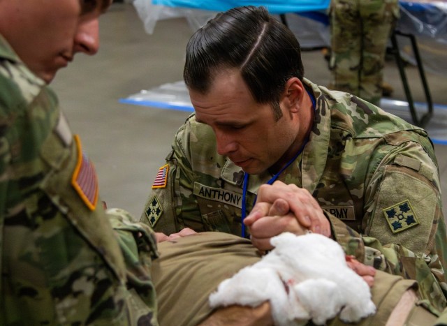 Chaplain provides care to the wounded.