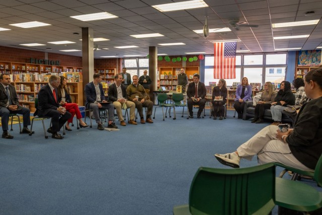 Community Leaders Gather for Round-Table Discussion in School Library