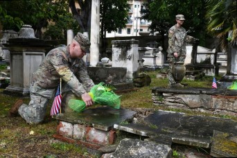 Camp Darby service members clean American graves in Livorno’s old English cemetery