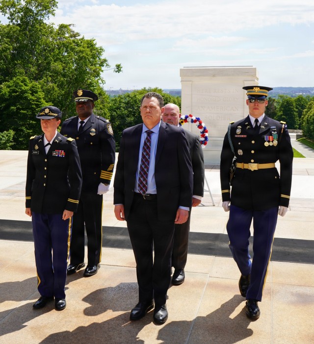 Members of law enforcement from Joint Base Myer-Henderson Hall lay wreath at Tomb of The Unknown Soldier