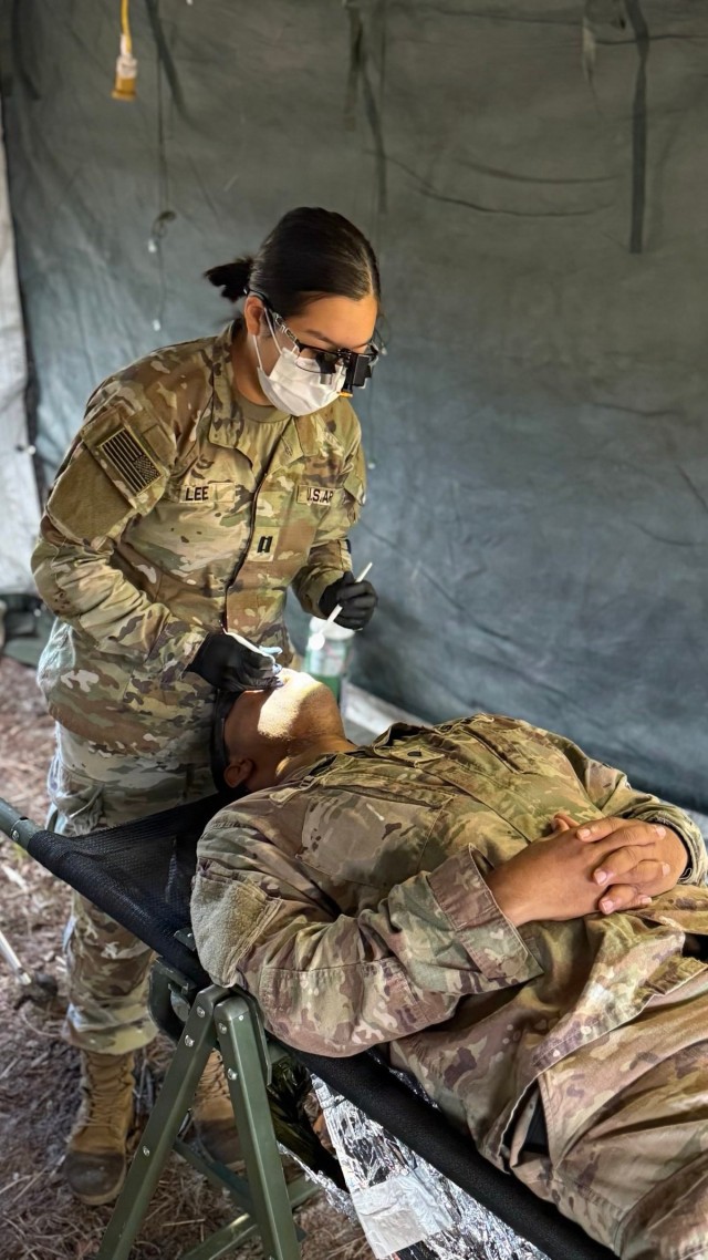 Dogface Soldiers conduct dental exams in the field