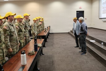 “Flight school class...don your hats!” Legacy Army Aviation leaders speak to new flight school students